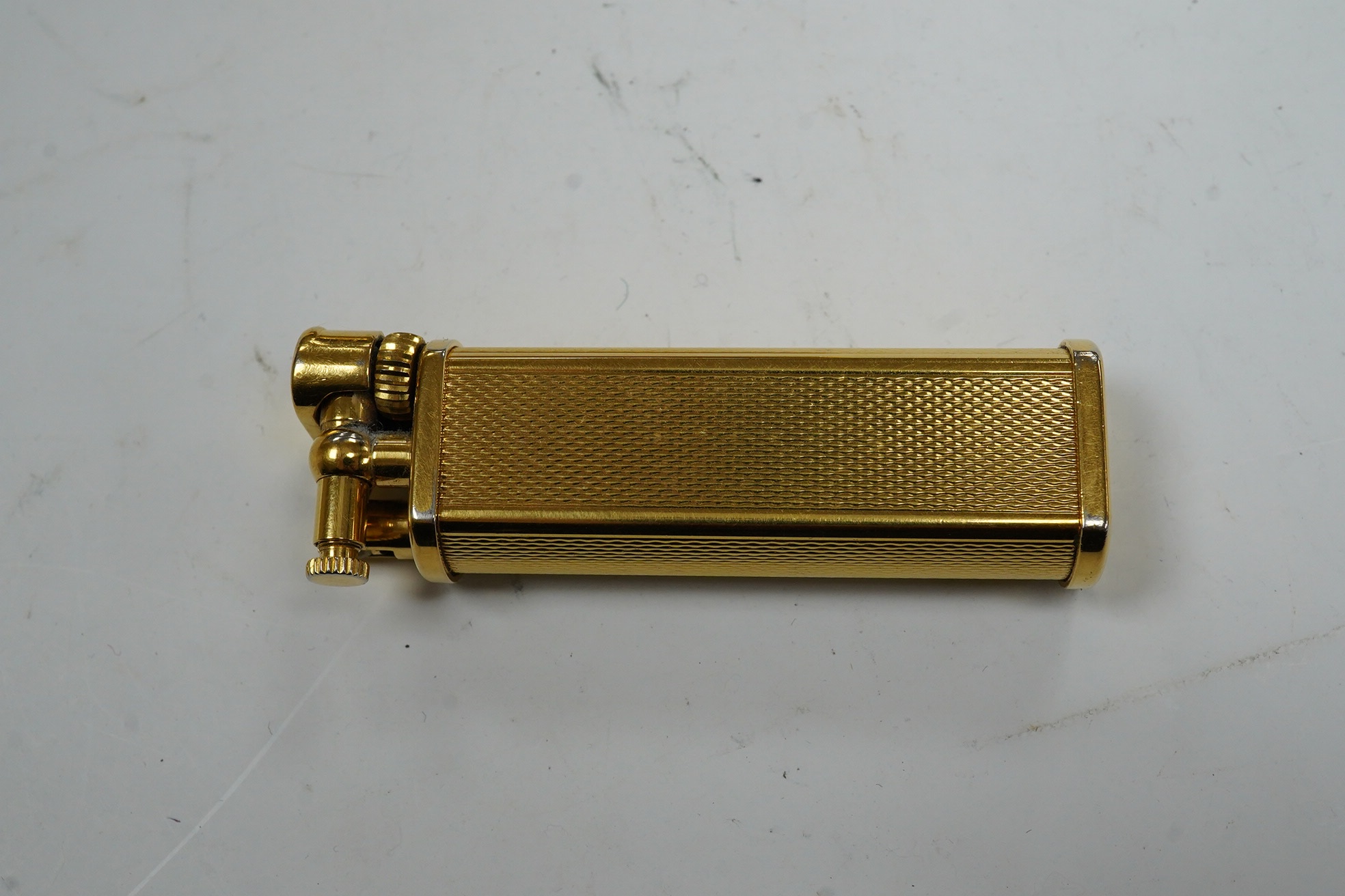 A Dunhill Sylphida lighter and Cartier lighter, numbered 88821. Condition - fair